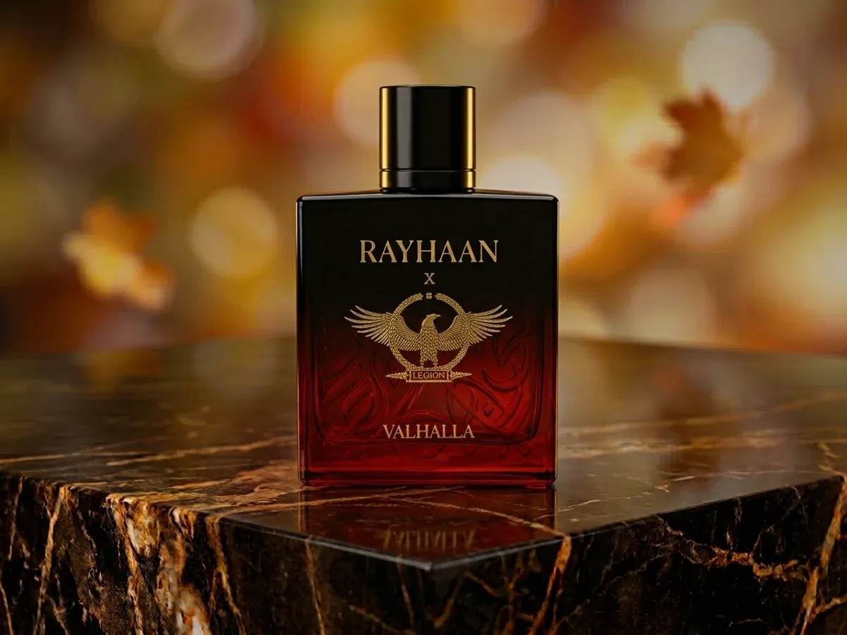 Bottle of Rayhaan Valhalla on dark marble with autumn leaves